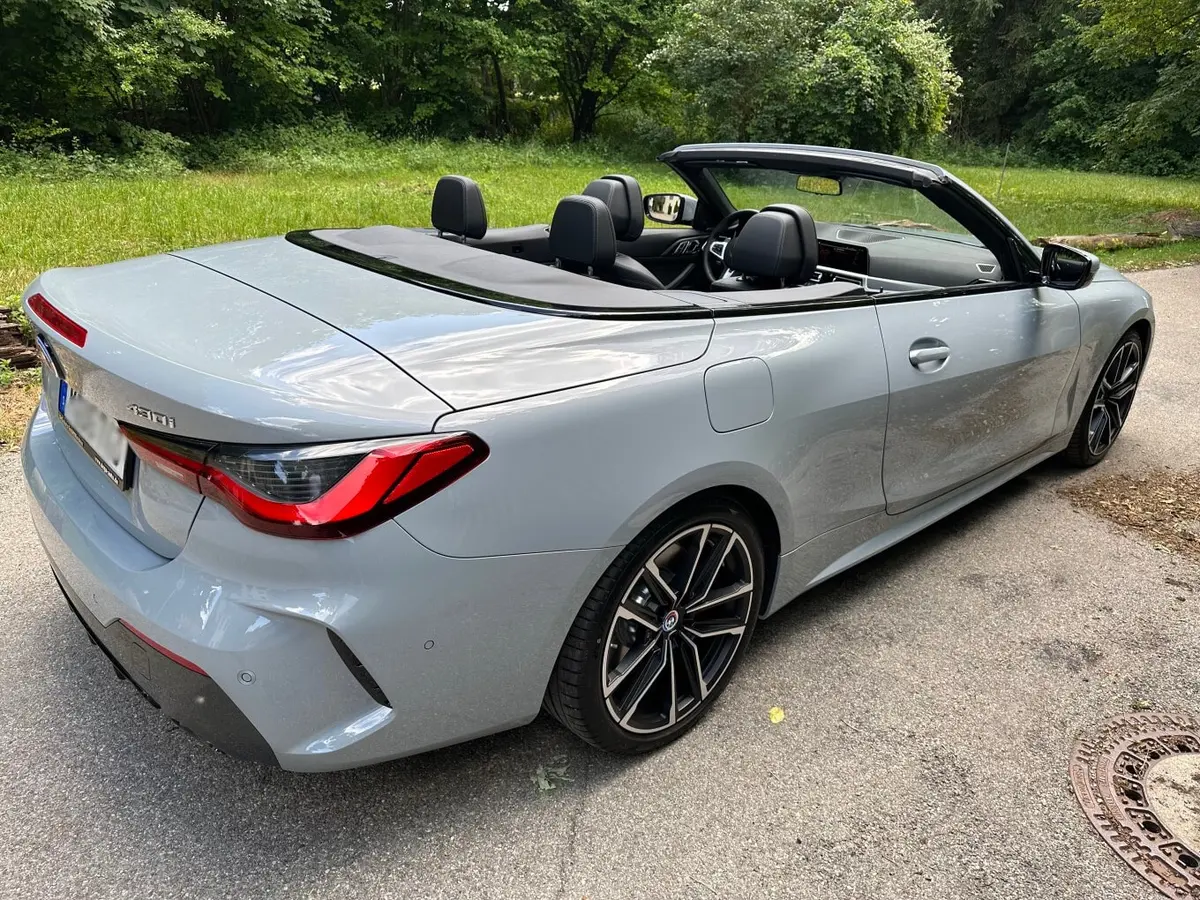 BMW 430i Cabrio 2023, exterior — Venice Lux Car Rental, Venice. The BMW 430i Cabrio pairs a 245 hp turbocharged engine with a folding top, giving it an…