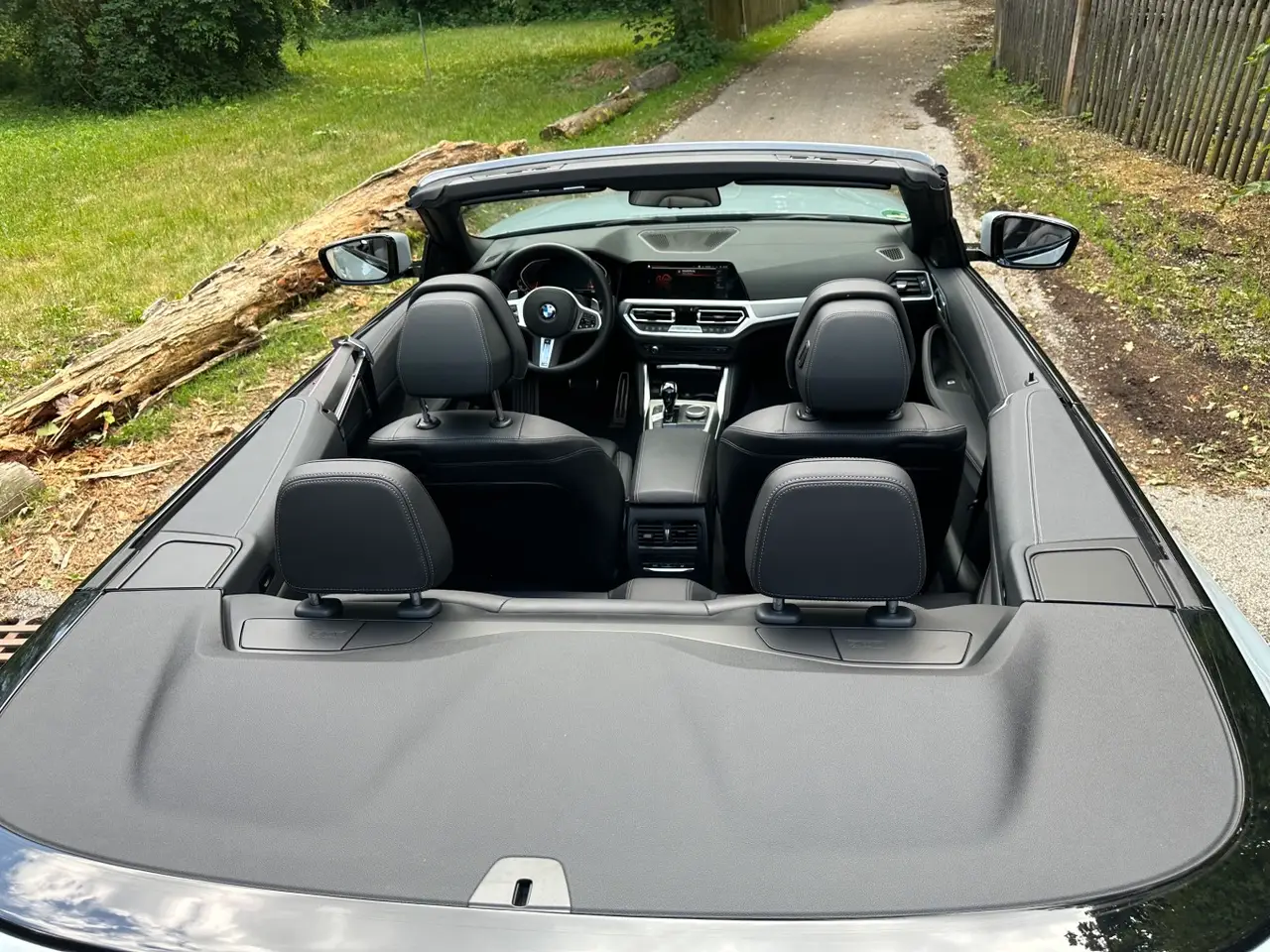 BMW 430i Cabrio 2023, rear view — Venice Lux Car Rental, Venice. The BMW 430i Cabrio pairs a 245 hp turbocharged engine with a folding top, giving it an…