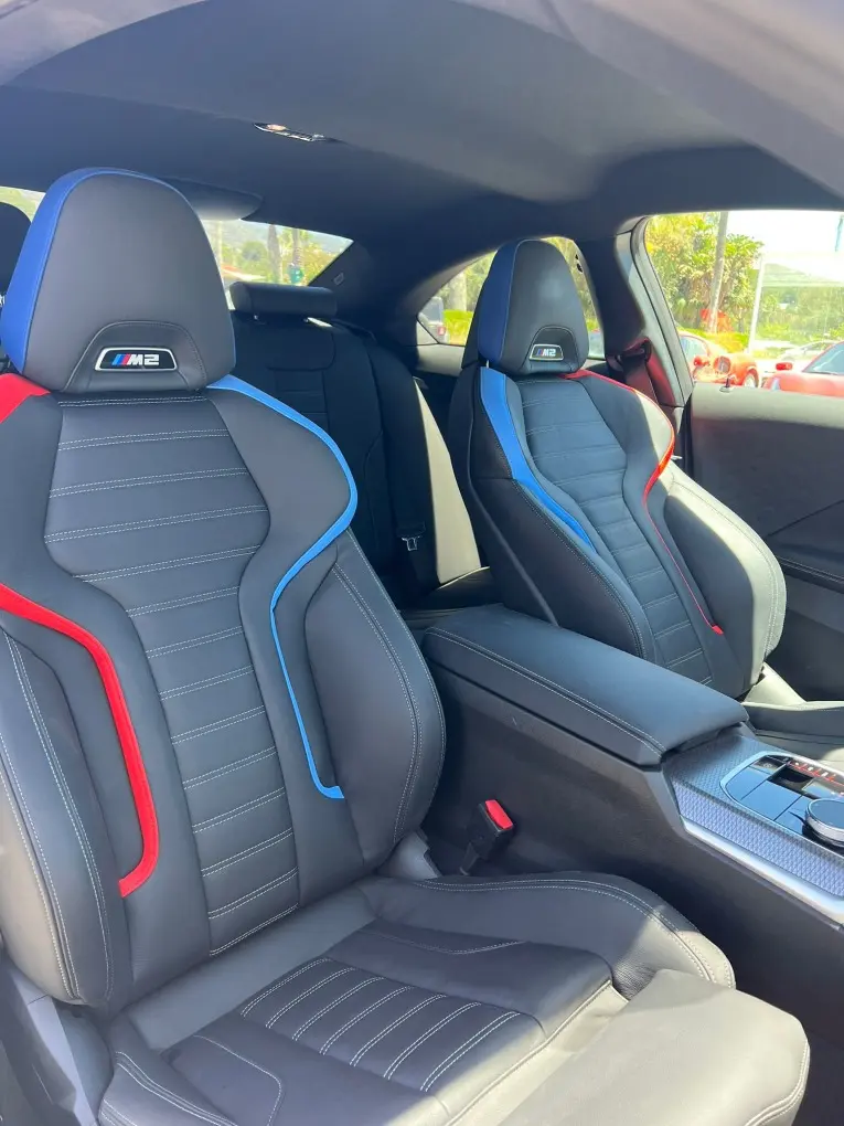 BMW M2 2024, rear view — Venice Lux Car Rental, Venice. The 2024 BMW M2 is the compact end of the sport lineup here, and it earns that spot…