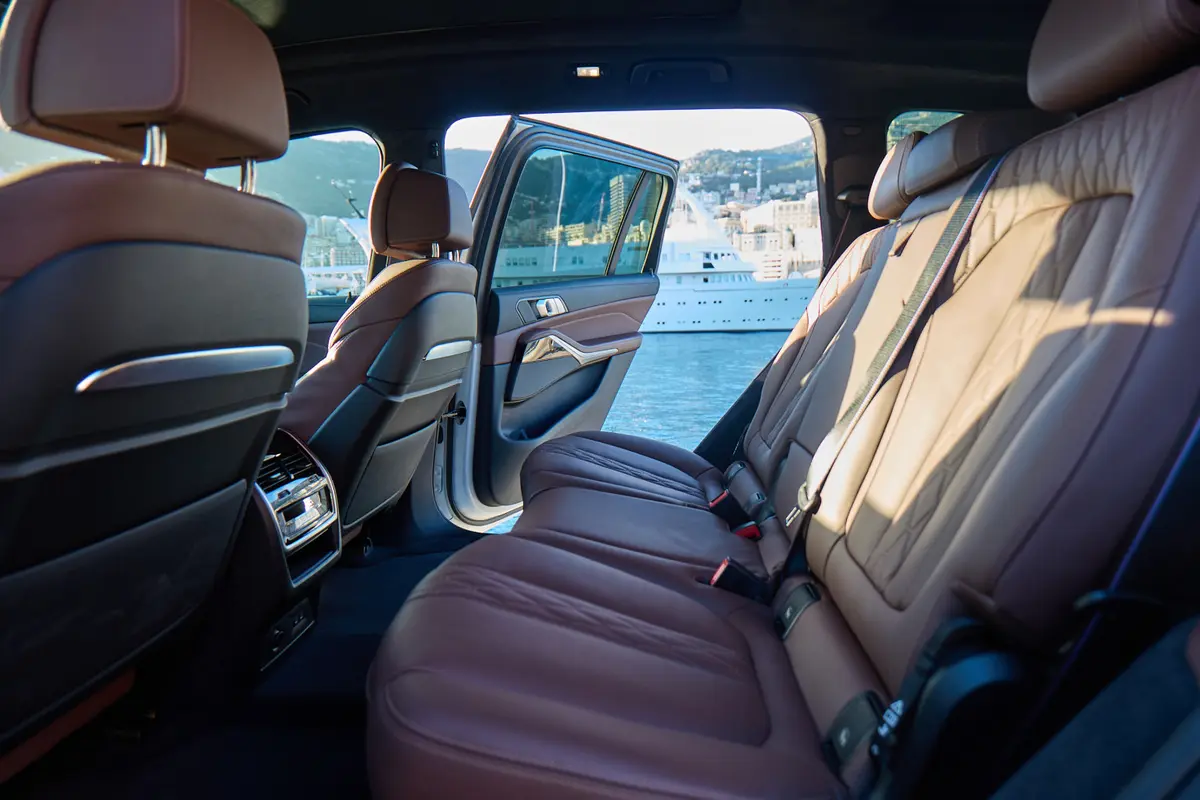 BMW X7 40d M 2024, rear view — Venice Lux Car Rental, Venice. The BMW X7 40d M carries seven seats and 352 hp inside a cabin wide enough to keep three…
