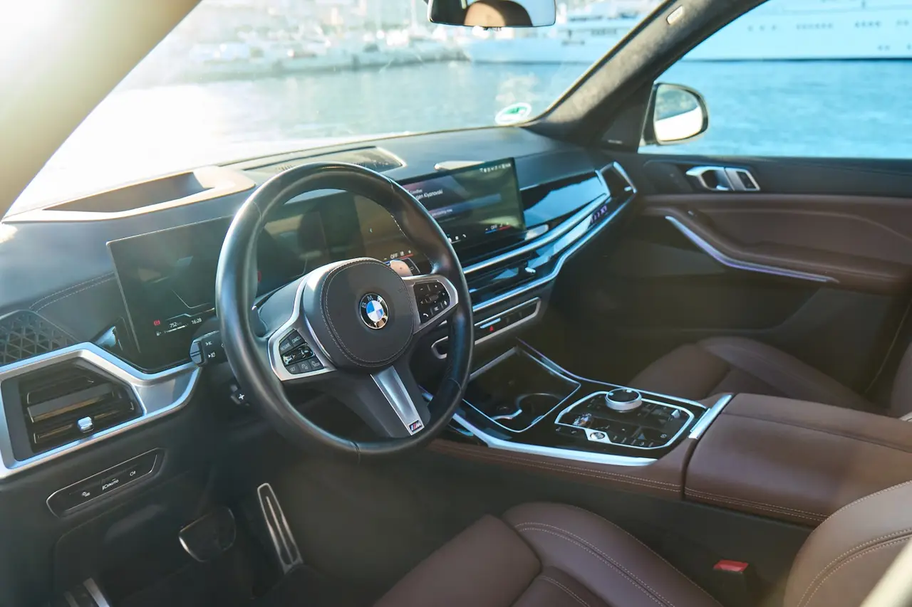 BMW X7 40d M 2024, interior — Venice Lux Car Rental, Venice. The BMW X7 40d M carries seven seats and 352 hp inside a cabin wide enough to keep three…