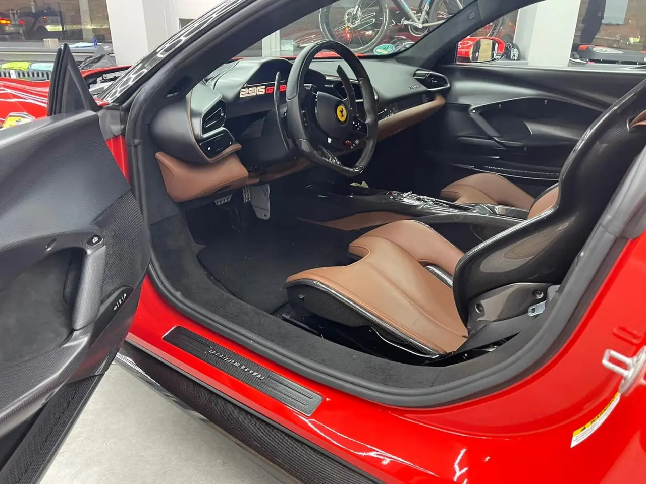 Ferrari 296 GTB 2023, front view — Venice Lux Car Rental, Venice. The Ferrari 296 GTB pairs a plug-in hybrid V6 with 830 hp, a combination that delivers…