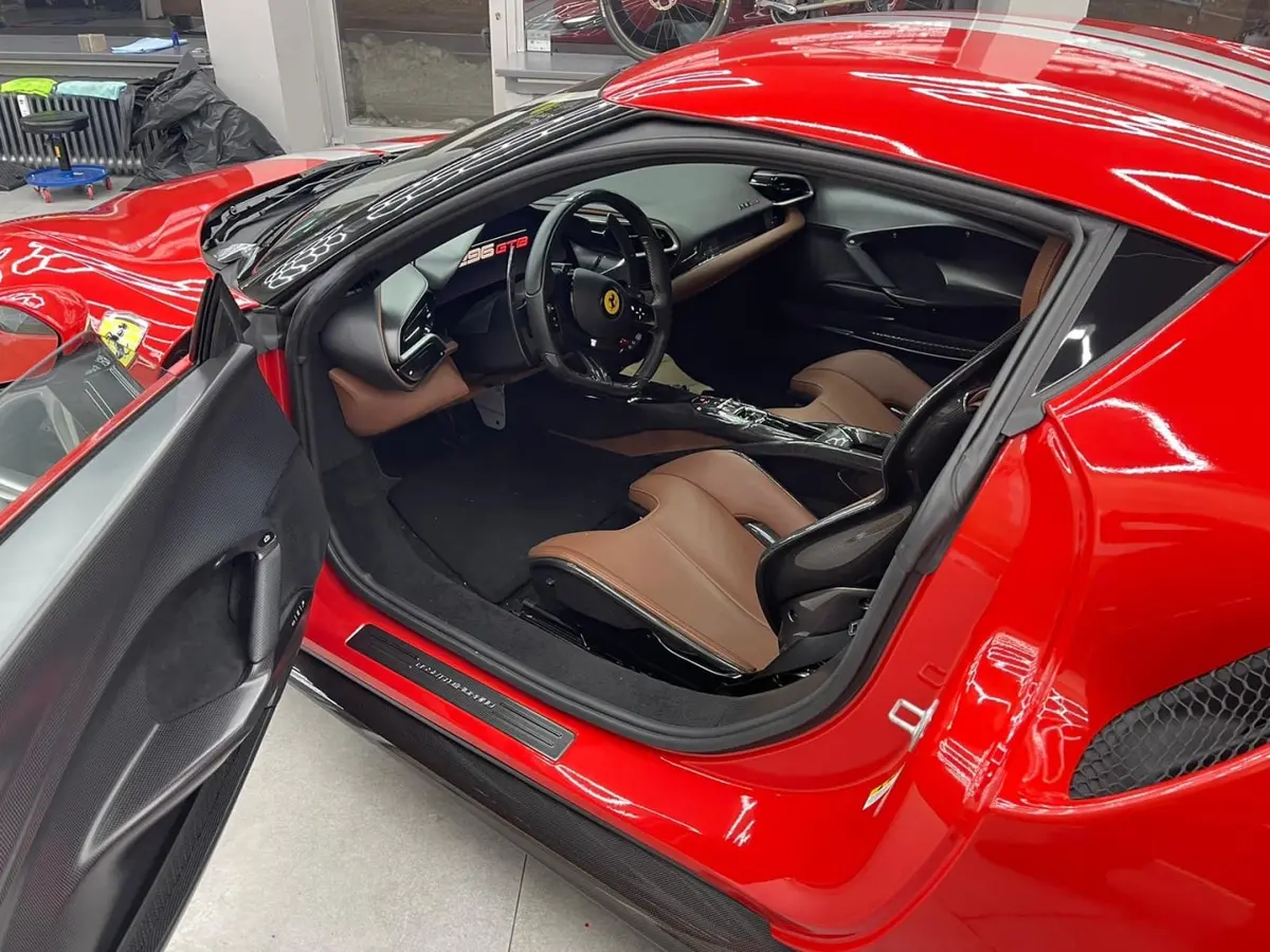 Ferrari 296 GTB 2023, rear view — Venice Lux Car Rental, Venice. The Ferrari 296 GTB pairs a plug-in hybrid V6 with 830 hp, a combination that delivers…