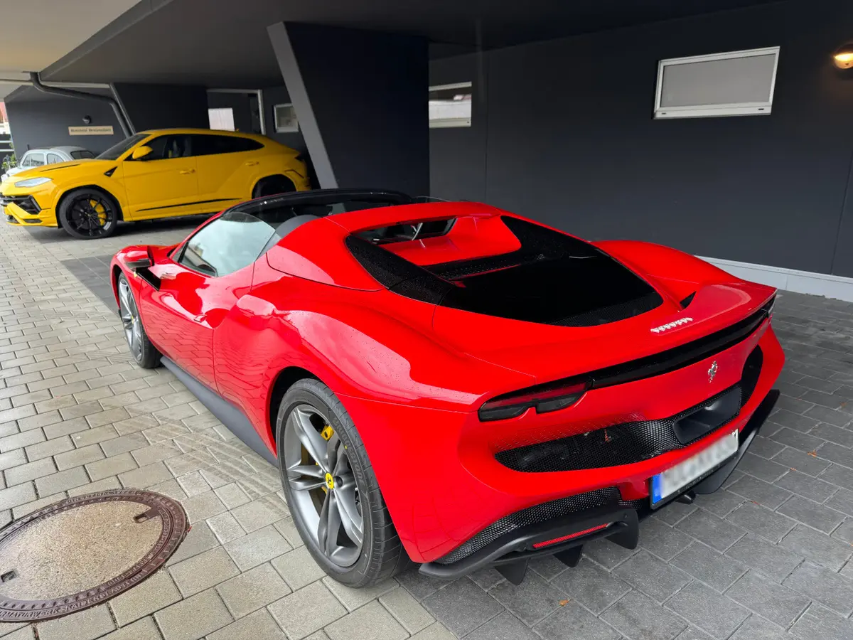 Ferrari 296 GTS Spider 2024, rear view — Venice Lux Car Rental, Venice. The Ferrari 296 GTS pairs 819 hp with a folding hard top, so the transition from sealed…