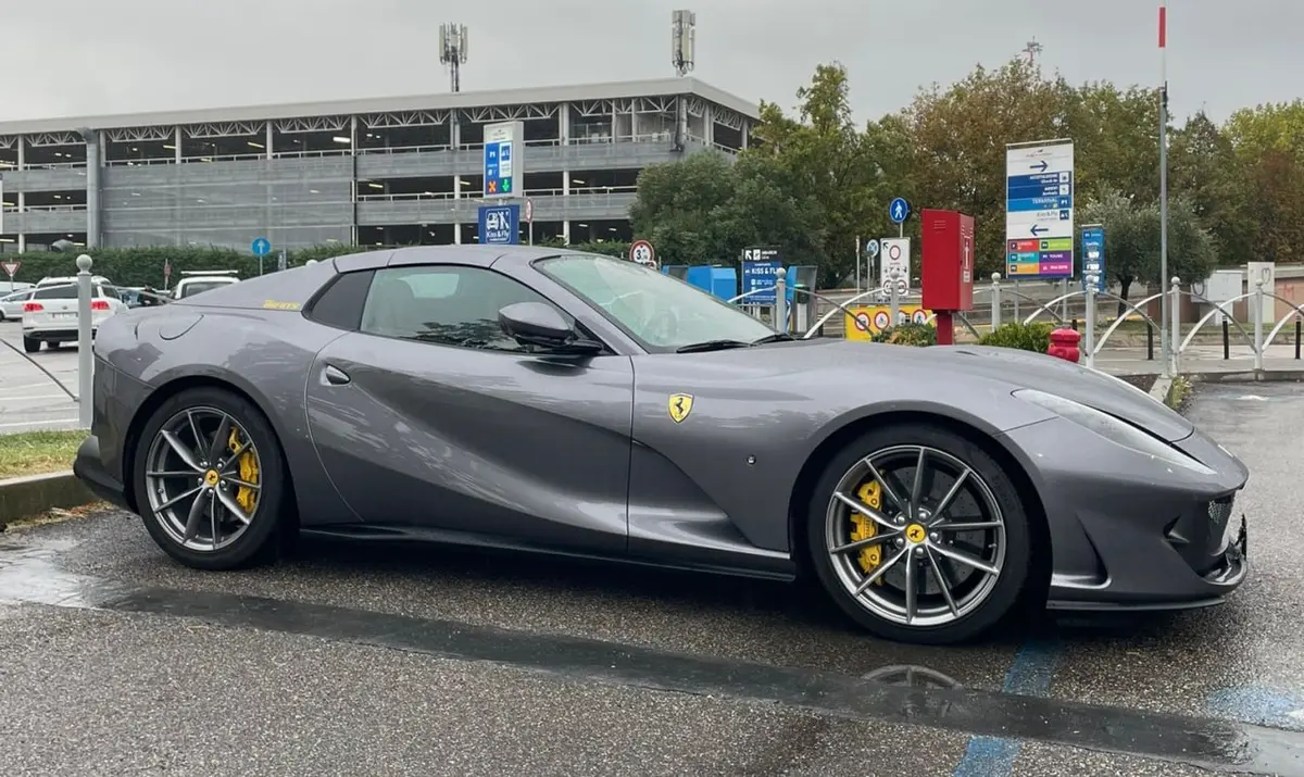 Ferrari 812 GTS 2024, rear view — Venice Lux Car Rental, Venice. The 2024 Ferrari 812 GTS puts 800 hp behind two seats and leaves little room for…