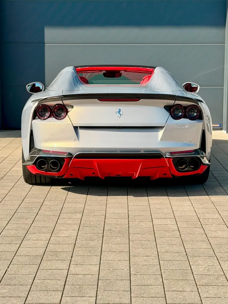 Ferrari 812 GTS 2024, rear view — Venice Lux Car Rental, Venice. The Ferrari 812 GTS pairs a 789 hp naturally aspirated V12 with a folding hard top, a…