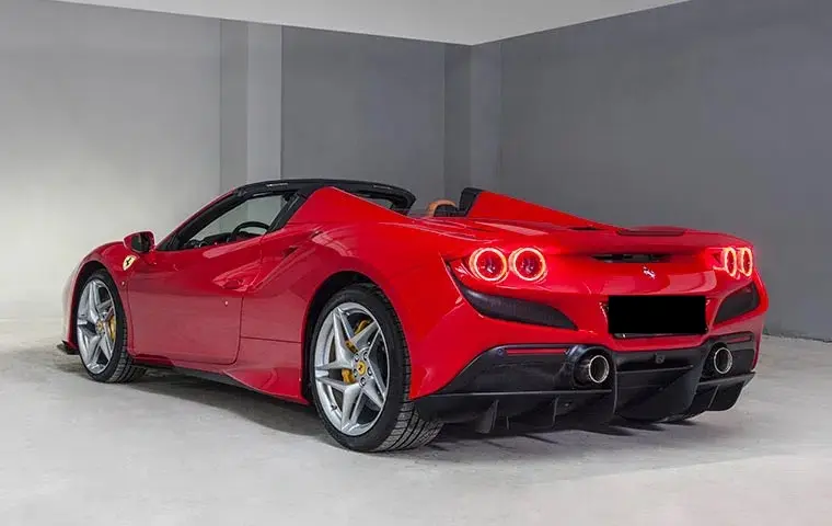 Ferrari F8 Tributo Spider Red 2023, interior — Venice Lux Car Rental, Venice. The Ferrari F8 Tributo Spider pairs a 720 hp V8 with a folding hard top, giving open-air…