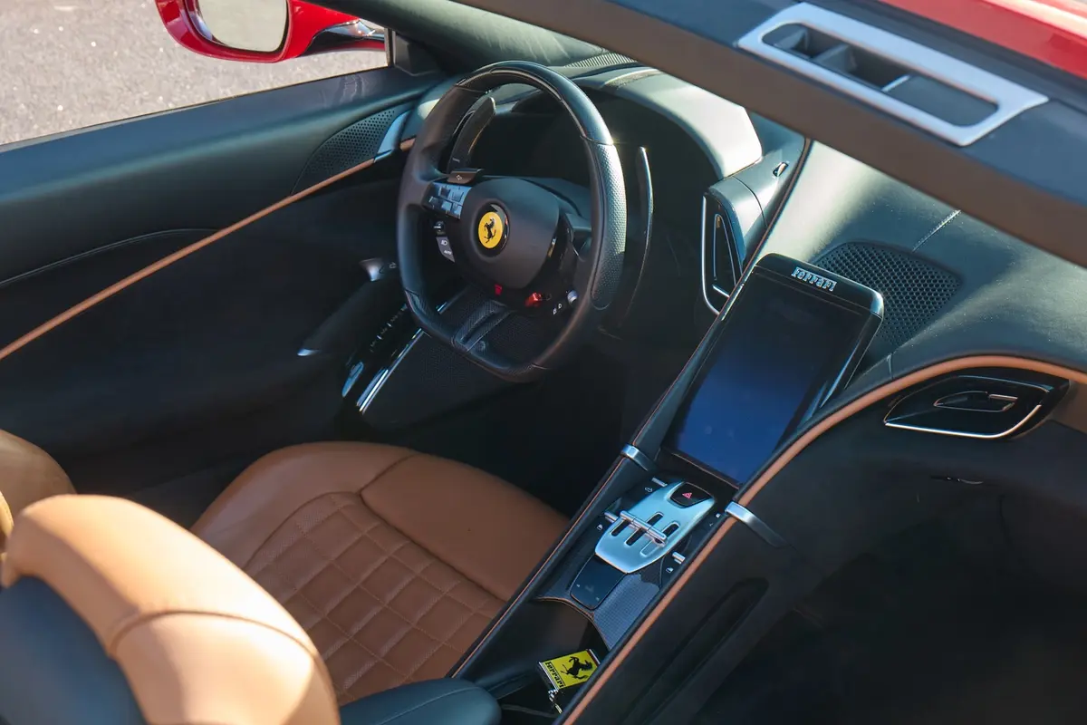 Ferrari Roma Spider 2024, rear view — Venice Lux Car Rental, Venice. The Ferrari Roma Spider pairs 620 hp with a soft-top that drops in seconds, built for…