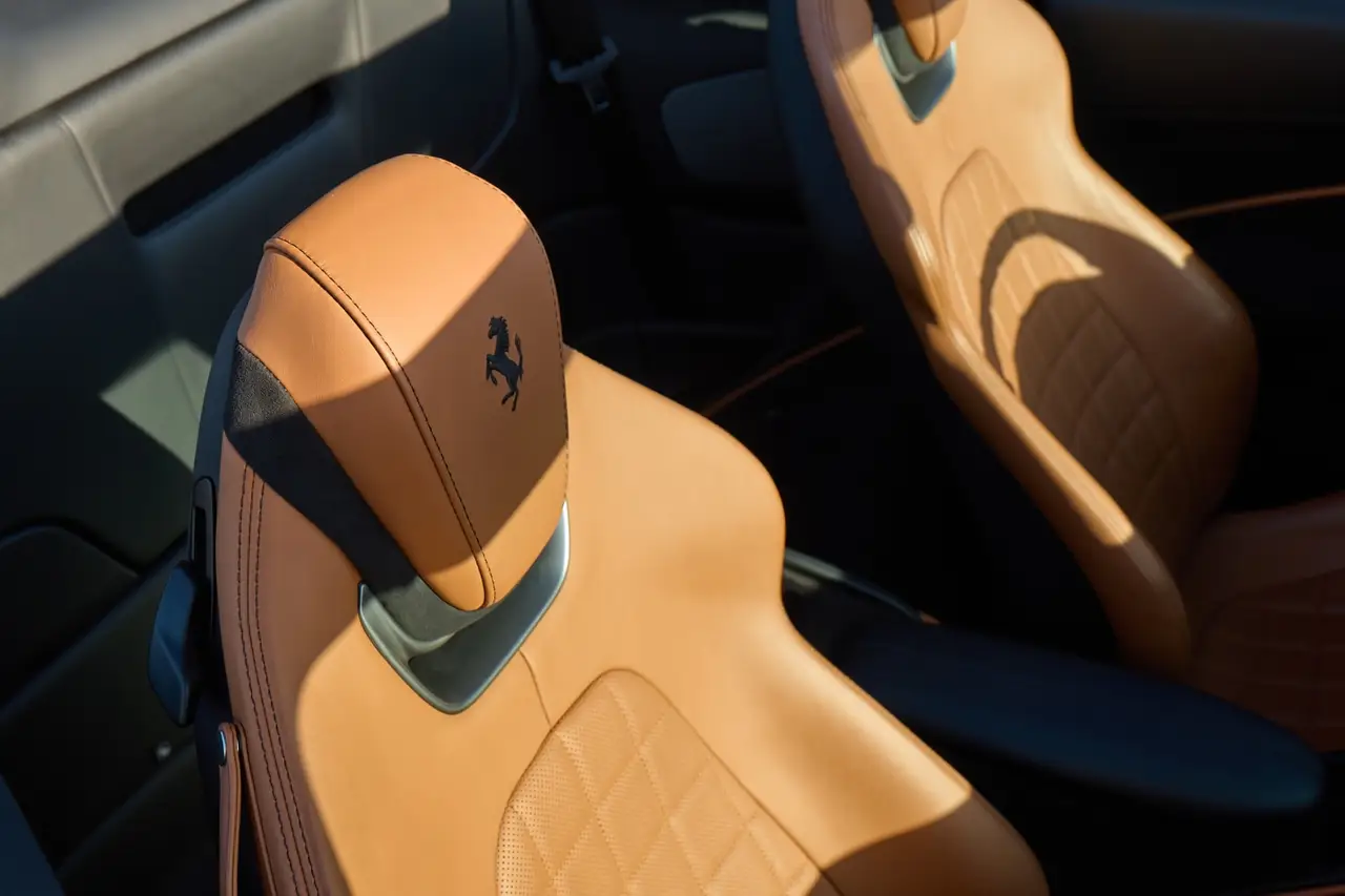 Ferrari Roma Spider 2024, interior — Venice Lux Car Rental, Venice. The Ferrari Roma Spider pairs 620 hp with a soft-top that drops in seconds, built for…