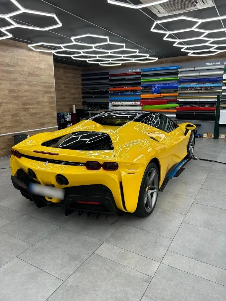 Ferrari SF90 Spider 2024, rear view — Venice Lux Car Rental, Venice. The Ferrari SF90 Spider sits at the top of what a two-seat convertible can do: 986 hp…
