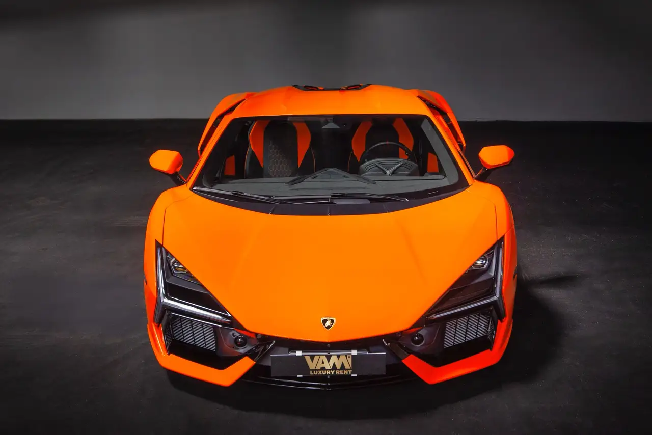 Lamborghini Revuelto 2026, rear view — Venice Lux Car Rental, Venice. The Revuelto sits at the top of Lamborghini's current range, a two-seat supercar…
