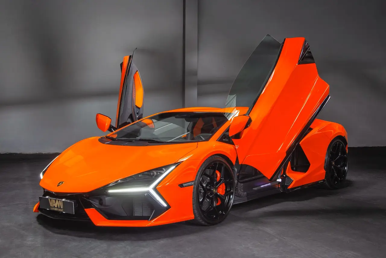 Lamborghini Revuelto 2026, side profile — Venice Lux Car Rental, Venice. The Revuelto sits at the top of Lamborghini's current range, a two-seat supercar…