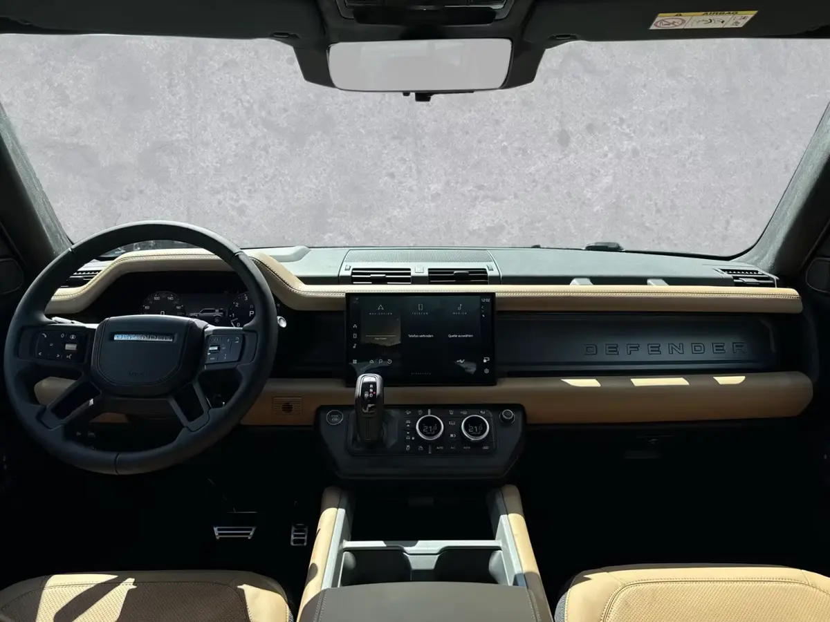 Land Rover Defender 2024, rear view — Venice Lux Car Rental, Venice. The 2024 Land Rover Defender pairs a commanding driving position with genuine seven-seat…