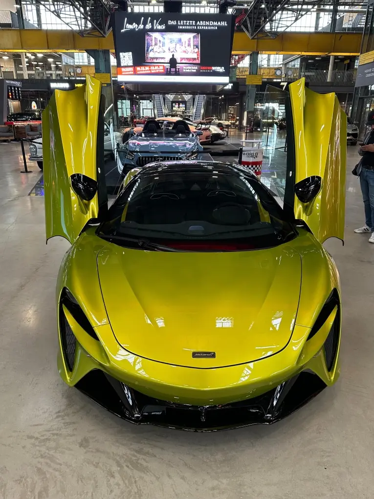 McLaren Artura Spider 2024, rear view — Venice Lux Car Rental, Venice. The McLaren Artura Spider pairs a twin-turbo V6 with electric assistance to produce 671…