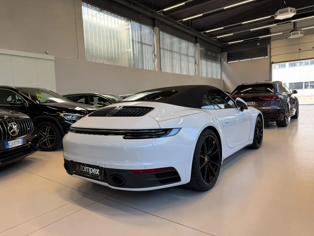 Porsche 911 Carrera S Cabrio (992) 2025, side profile — Venice Lux Car Rental, Venice. The 2025 Porsche 911 Carrera S Cabrio (992) is built for drivers who want engagement over…