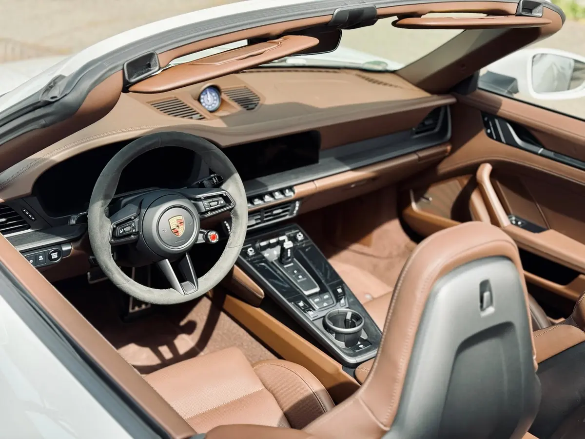 Porsche 992.2 Carrera 4 GTS Cabrio 2025, interior — Venice Lux Car Rental, Venice. The 992.2 Carrera 4 GTS Cabrio pairs 540 hp with all-wheel drive, a combination that…