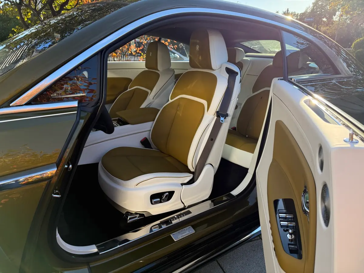 Rolls-Royce Spectre 2024, rear view — Venice Lux Car Rental, Venice. The Rolls-Royce Spectre is Rolls-Royce's first electric coupe, and it carries the badge's…
