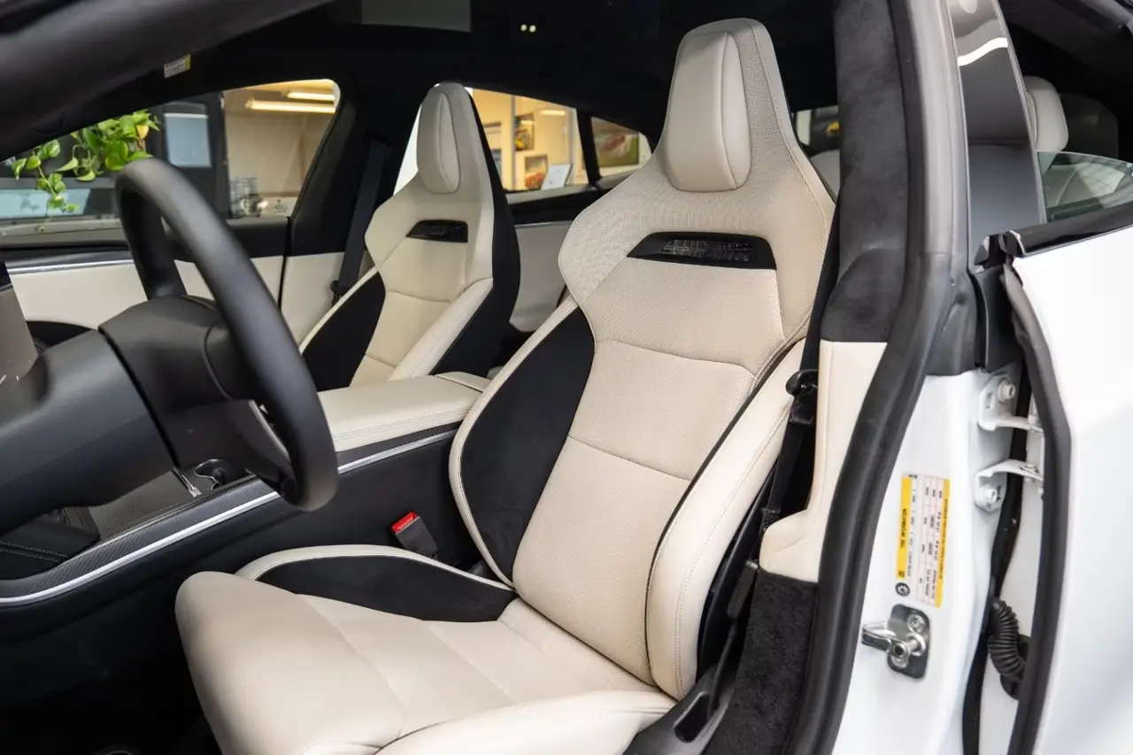 Tesla Model S Plaid 2025, rear view — Venice Lux Car Rental, Venice. The Model S Plaid trades the theatrics of a combustion supercar for something quieter…